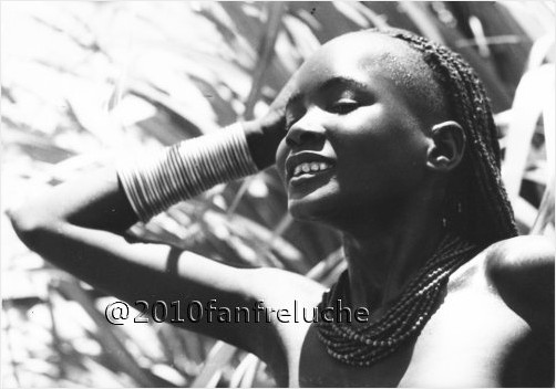 Smiling African girl with bracelets and necklace