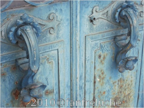 Photo: old handles on crypt's wrought iron door. Pere Lachaise cemetery, Paris France
