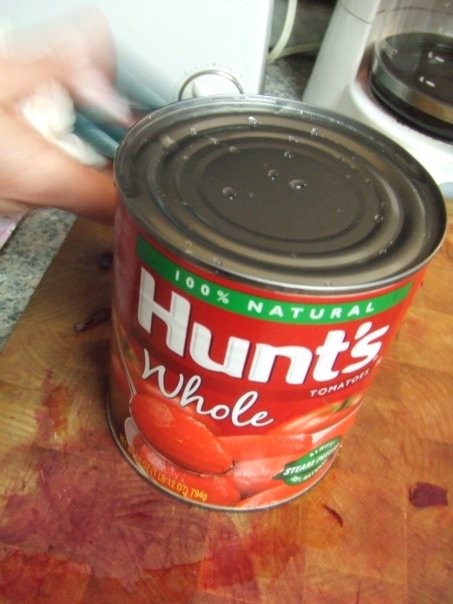 Next, Grandma and Mom yell at me to wash off the top of the can which I was about to do anyway  Use one large can, 28 oz , of whole tomatoes  Use the entire contents of the can basically, DON'T DRAIN THEM  Grandma Vera's note: Use the good stuff  Only use